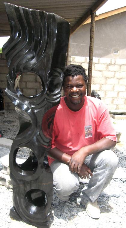Chemedu Jemali with shona sculpture